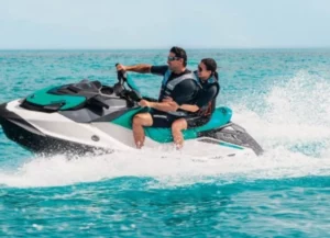 Rent a jet ski on Oneida Lake. Two people riding a jet ski on the picture.